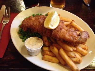 Eat fish and chips behind Big Ben in The Red Lion